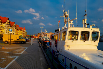 2022-06-02 view of quay, harbor with yachts at mouth of Slupia on the sunset. baltic sea, ustka, poland
