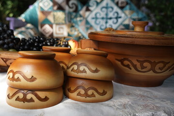 Fototapeta na wymiar Wooden carved tableware with Kazakh national pattern