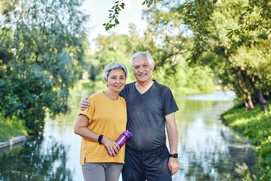 Attractive older couple in the summer park