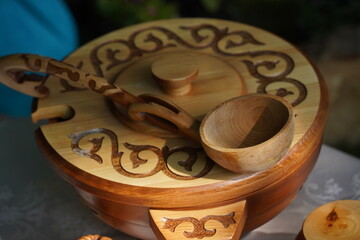 Wooden carved tableware with Kazakh national pattern