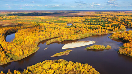 Aerial photography of landscape in Western Siberia. Agan River. Autumn landscape. Bird's eye view.