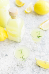 Italian traditional liqueur limoncello with thyme