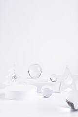 Christmas podium stands with decorations and glass spheres.