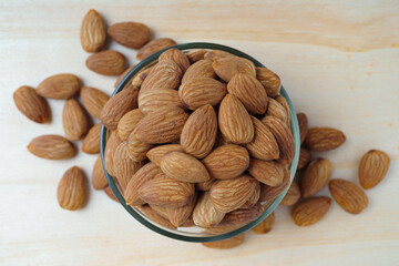 almonds in a bowl on a wooden table, proper nutrition, keto diet
