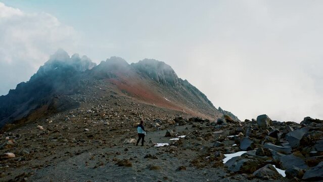 man walking on the north face of pico de orizaba