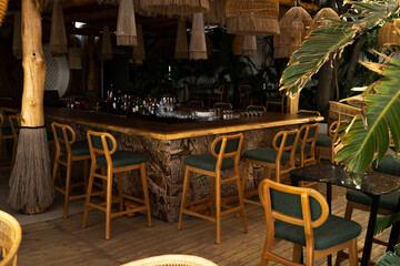 Bar counter with wooden chairs on the shore before opening
