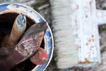 Old paint brushes on the table. Painting the wall in the house.