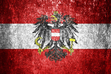 Closeup of grunge Austrian flag. Dirty Austrian flag on a metal surface.