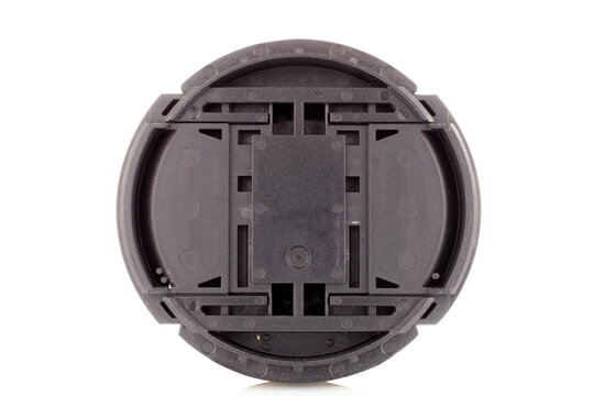One plastic cap on a camera lens, macro, isolated on a white background