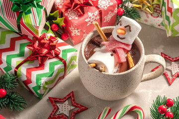 Mug with hot chocolate with melted marshmallow snowman. Merry Christmas drink. Happy Holiday card