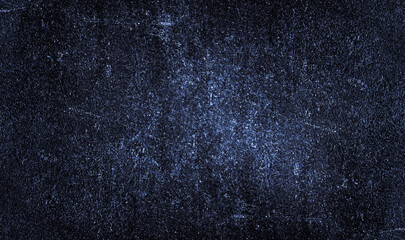 Black blue background with light white spots, particles. Dark blue old rough rusty metal plate...