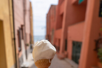 white ice cream in a cone in the streets of varigottti italy