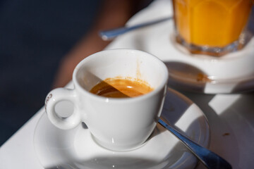 italien espresso in a white cup on a white saucer 