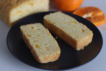 Fototapeta na wymiar Orange cake. Tea time cake with orange juice and orange pulp