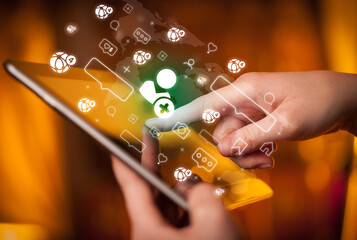 Close-up of a hand using tablet, social media concept