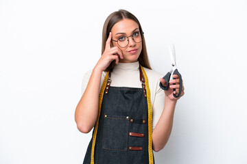 Young seamstress woman isolated on white background thinking an idea