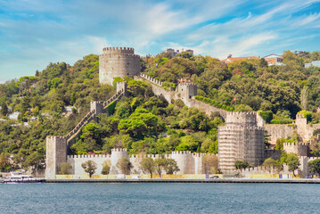 Obraz premium View of ruins of Rumelihisari, Bogazkesen Castle, or Rumelian Castle, in a sunny day, located at the hills of the European side of Bosphorus Strait, Istanbul, Turkey, built by Ottoman Sultan Mehmet II