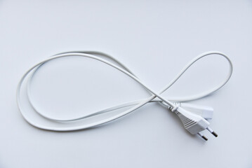White power cord on a white background. Electric cord on a white background.