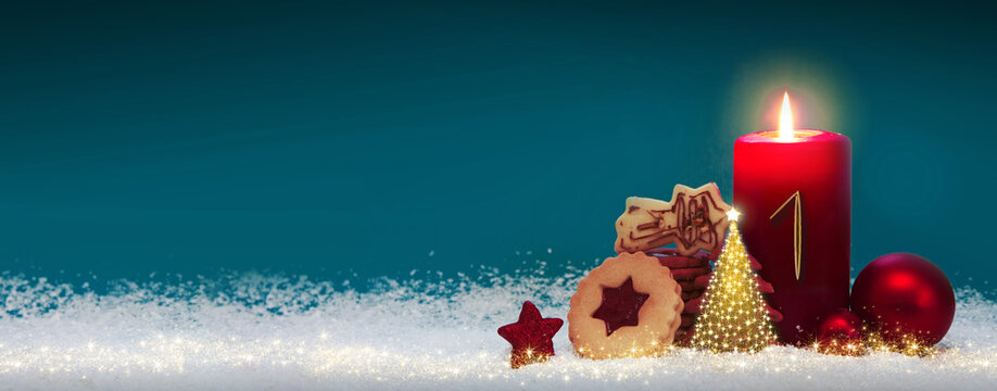 First Advent. Christmas background with Advent candle and decoration.