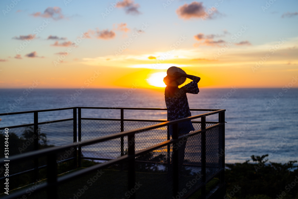 Poster Woman look at the sunset in balcony