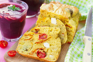 Savoury cake with curry, chorizo, cherry tomatoes, olives and feta - 531494654