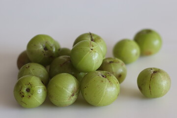 Amla or gooseberries shot on a white background.