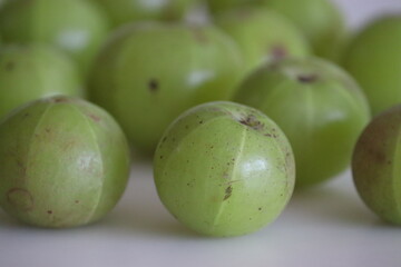 Amla or gooseberries shot on a white background.
