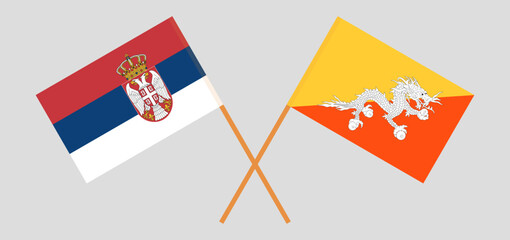Crossed flags of Serbia and Bhutan. Official colors. Correct proportion