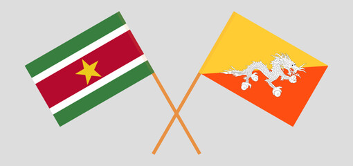 Crossed flags of Suriname and Bhutan. Official colors. Correct proportion