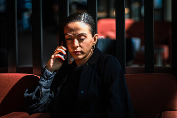 woman on the phone thinking 