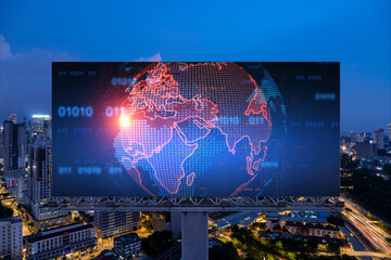 Obraz premium Hologram of Earth planet map on billboard over night panoramic cityscape of Kuala Lumpur, Malaysia, Asia. The concept of international companies in KL. Globe