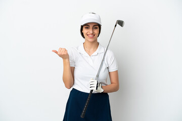 Handsome young golfer player woman isolated on white background pointing to the side to present a product