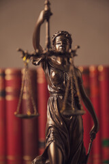 justice statue holding a balance and sword for law and justice concept