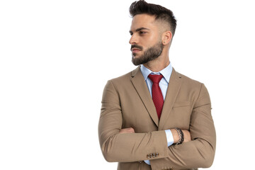 confident unshaved businessman folding arms and looking to side