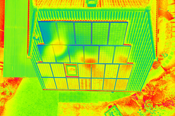 Thermographic inspection of photovoltaic systems by house.Thermovision image of solar panels....
