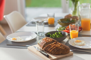 Breakfast with eggs, wholegrain bread, green fresh broccoli, and orange juice