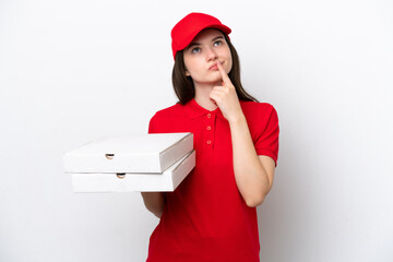 Young Russian pizza delivery picking up pizza boxes isolated on white background having doubts...