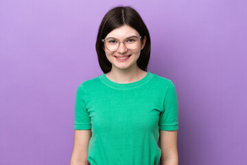 Obraz premium Young pretty Russian woman isolated on purple background With glasses with happy expression