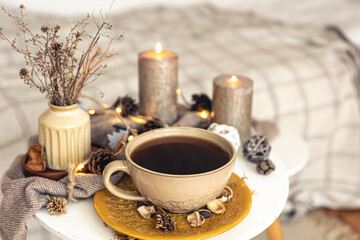 Obraz na płótnie Canvas Cozy autumn composition with a cup of tea and decorative details.