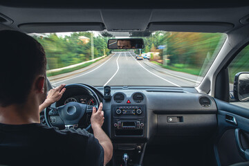 Hands on the wheel when driving at high speed from inside the car.