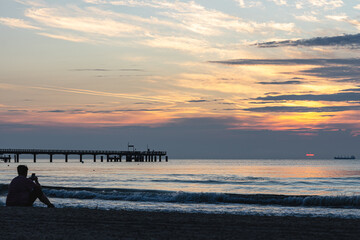 Fototapeta premium Beautiful seascape with a bridge at sunset.