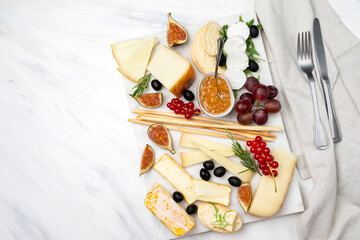 Cheese board with pecorino  brie goat cheese with crackers and grissini breadsticks  figs jam...