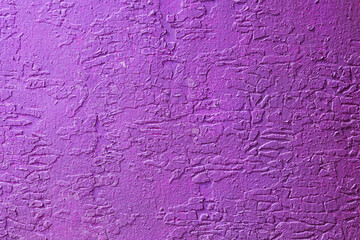 Abstract background of weather and time damaged paint on the wall.