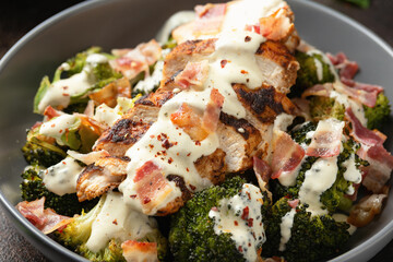 Baked chicken, broccoli with creamy cheese sauce and bacon