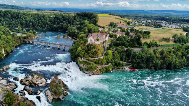 Rheinfall, Rhine Falls, Switzerland drone aerial view.. Bridge and border between the cantons Schaffhausen and Zurich. Cliff-top Schloss Laufen castle, Laufen-Uhwiesen. © Krzysztof