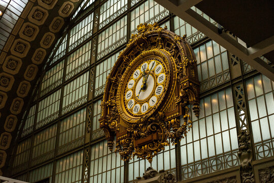huge golden clock on magnificent building
