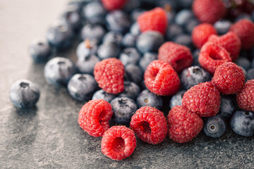 Background of raspberries and blueberries, macro photography.