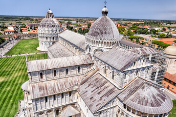 Fototapeta premium Pisa, Italy - July 24, 2022: Tourists taking in the sights at the leaning tower of Pisa 