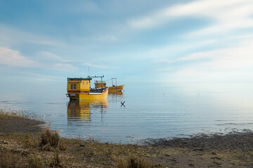 Two small fishing boats close to the beach of Villa del Mar in the province of Buenos Aires, Argentina.