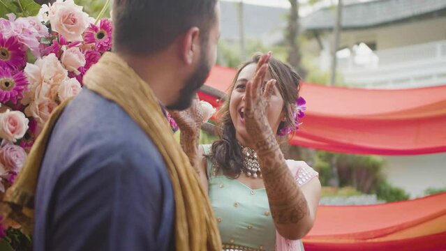 Portrait Of A Happy Couple At Mehndi Wedding Function During Their Pre-wedding Celebration. Medium Shot
